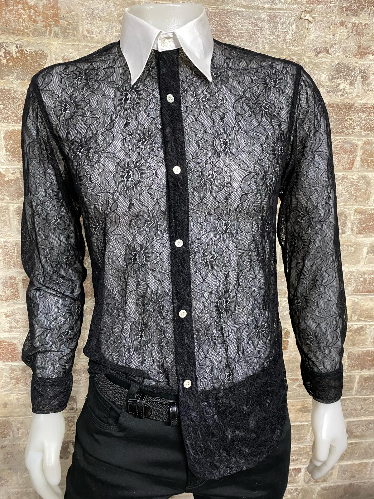 Black lace shirt with white collar on a mannequin against a brick wall background