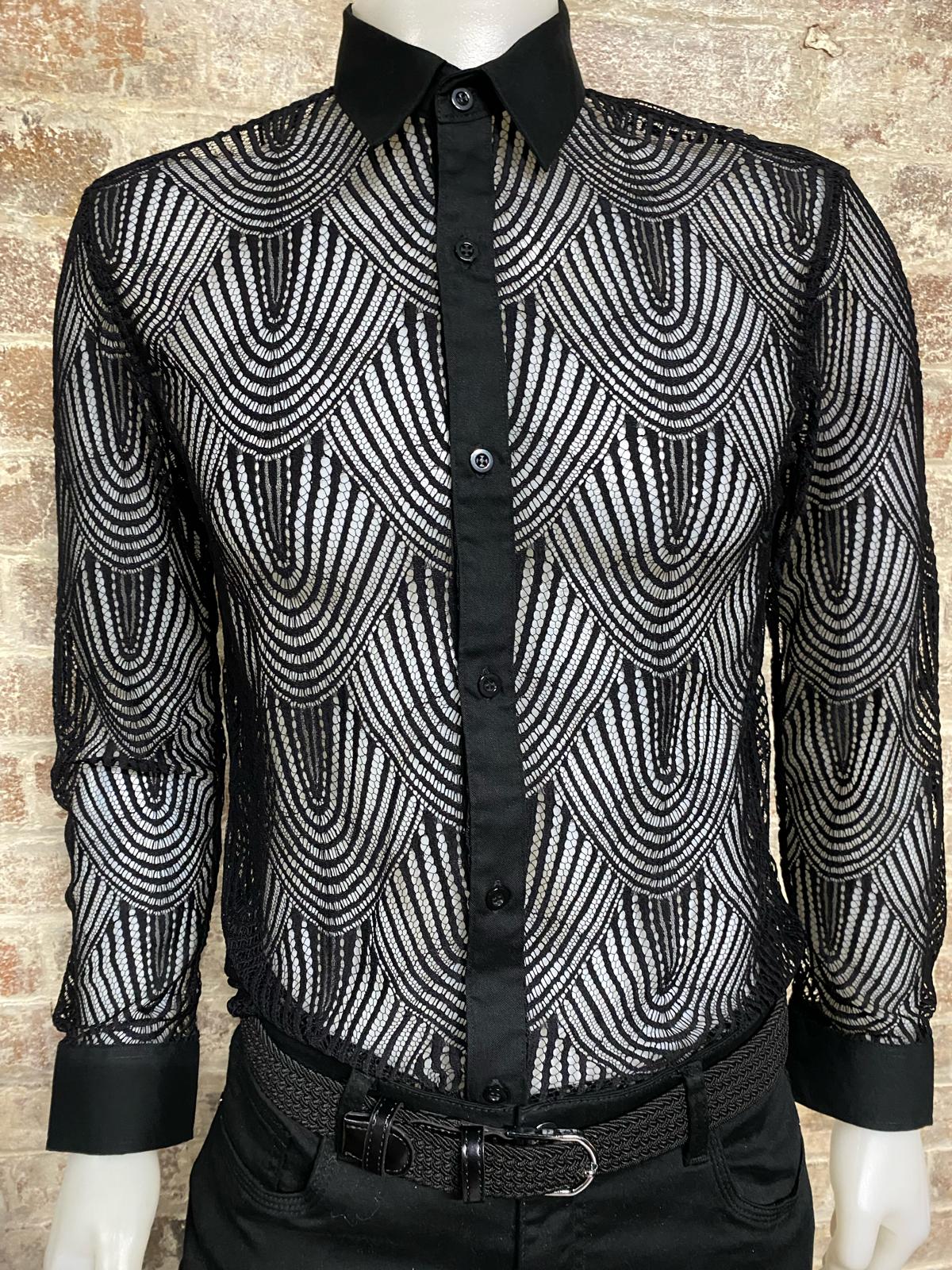 Black and white patterned shirt on a mannequin against a brick wall background